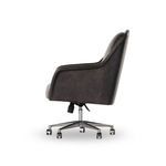 Side profile showing chair’s curved armrest and swivel lever under the seat