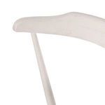 Detailed close-up of top edge of off-white wooden backrest with visible grain texture