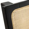 Close-up of black wood corner frame and woven cane texture on headboard panel
