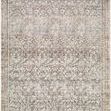 Rust and green machine woven rug with intricate vintage floral motifs and a medium pile