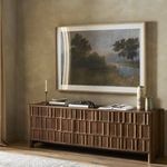Alternate view of painting above console showing light reflection on glass and room ambiance