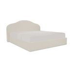 Maggie Storage Bed angled view showing tapered silhouette and twisted trim detail on cream upholstery