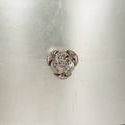 Close-up of crystal drawer pull with faceted reflective design on silver-leaf amber glaze background