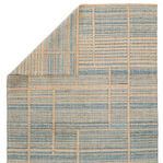 rug turned over showing reverse side with same striped pattern in muted colors