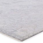 close-up angled view showing flat weave texture and color blending of gray and beige tones