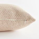 close-up of beige Blake Lumbar pillow zipper on back edge