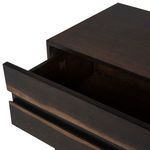 Prana Side Table in sleek black wood with thin black metal legs and a drawer front with natural wood grain texture