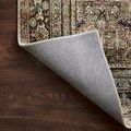 rug corner flipped up showing light gray underside and stitched binding