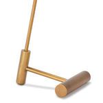 Close-up of brass-toned metal kickstand base showing cylindrical shapes and smooth finish