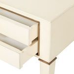 Two drawers open revealing ivory leather interior and brass framing details