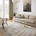 Soho Multi / Dove Rug styled in a bright living room with beige sofa and armchair