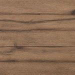 Zoomed-in view of the weathered oak surface with visible knots and grain patterns