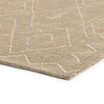 Close-up angled view showing the rug’s woven texture and hand-knotted edge detail