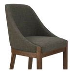 Close-up angled shot showing upholstery texture and wood grain detail on chair frame