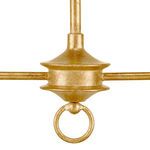 Close-up detail of textured gold leaf finish on central cog with attached ring