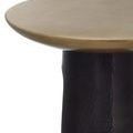 Close-up of tabletop edge over black hammered base from a low viewpoint