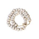 Close-up of Kenya Cow Bone Drum Beads details showing smooth texture and natural color variations
