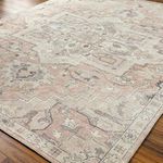 Detailed angled view showing the rug’s textured, plush medium pile on a wood floor.