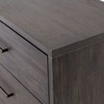 Side profile highlighting vertical wood grain and subtle lighting on dark wood finish