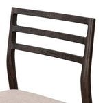 Close-up of the top right corner of the ladderback highlighting wood grain and smooth finish
