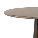 Close-up of light grey marble tabletop edge showing texture and color variations