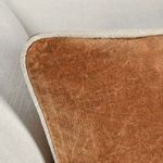 Close-up of pillow corner highlighting texture and fine stitching of piping