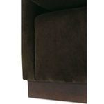 Close-up of wooden base beneath the chair showing a smooth dark finish with minor imperfections