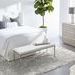 Full bedroom setting with Stewart Queen Bed, nightstand, dresser, tall plant, and textured rug