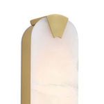 Close-up side view showing brass-finished metal frame detail over alabaster slab of Houston Linear Sconce
