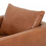 Close-up of Kaya chair back cushion with smooth tobacco leather surface
