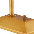 Close-up detail of knurled rotary control knob on brass trapezoidal base