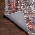 Corner fold revealing the rug’s textured gray backing contrasting with the brick and ivory woven front