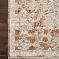 Close-up of Theia Natural / Rust Rug corner showing detailed rust accents and fringe on wood floor