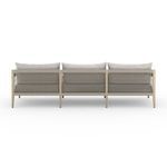 Back view showing woven cotton rope pattern along entire rear of washed teak outdoor sofa frame
