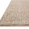 Close-up side view of Clarisse rug showing low pile thickness and edge detail