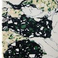 Macro view of Fossey Object showing glossy synthetic stone texture with sharp color contrasts and speckles