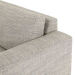 Close-up side view focusing on fabric details and cushion alignment