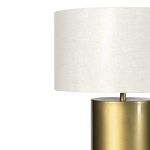 Close-up of off-white lampshade fabric with slight texture under soft lighting