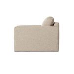 Side profile view of chair highlighting straight armrest and back cushion height