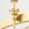 Close-up of gold floral accent detail connecting rod to circular frame