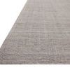 Low angle view showing thin textured lines and flat hand-loomed weave of the Thorne Grey Rug