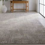 Sylvana Trellis rug angled showing luminous sheen and fading trellis pattern near console table