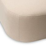 Close-up of seam detail and fabric texture at front corner of the chaise seat