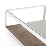 Close-up corner showing reflection on steel frame and textured brown shagreen base