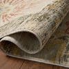 rug partially rolled to reveal backside weave and thickness of the botanical pattern