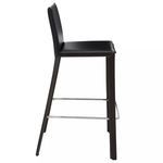 Side profile of Bridget Bar Stool highlighting padded seat thickness and dual chrome footrests.