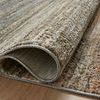 Detail of Soho Earth rug edge rolled to reveal soft textured pile