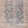 Traditional machine-woven Marlene area rug in ink blue with floral motifs and a beige border, medium pile