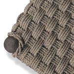 Close-up of table corner showing thick rope weave wrapped tightly around rounded tapered leg