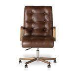 Front-on chair view highlighting symmetrical tufting and wood arms with polished base.